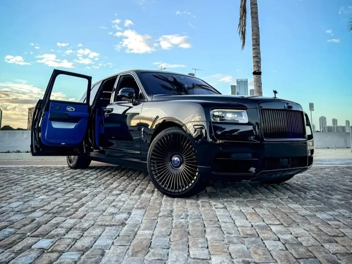 Black Rolls-Royce Cullinan parked outside